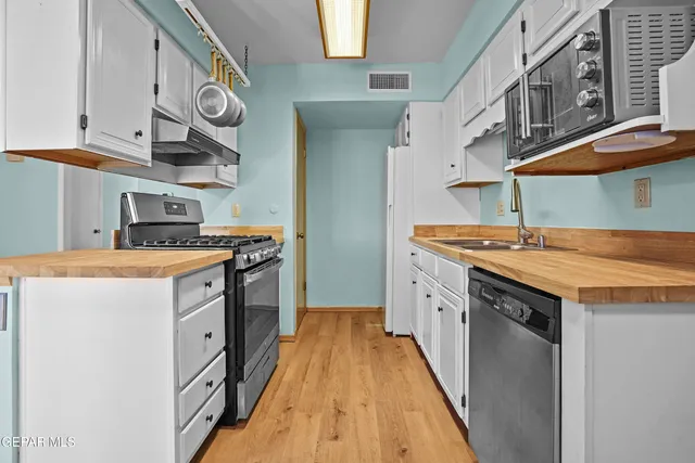 a white toilet sitting next to a bath tub and shower