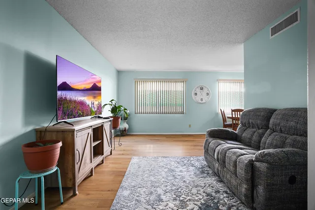 a bed room with a bed and a dresser