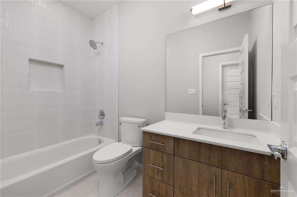 2701 Robin Road Weslaco, TX 78596 - Photo 11 of 30 a bathroom with a sink a toilet and shower