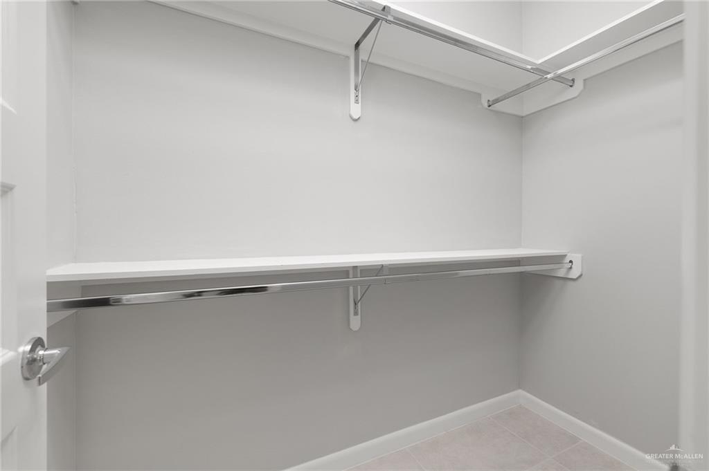 2701 Robin Road Weslaco, TX 78596 - Photo 14 of 30 a view of a room with racks on the wall