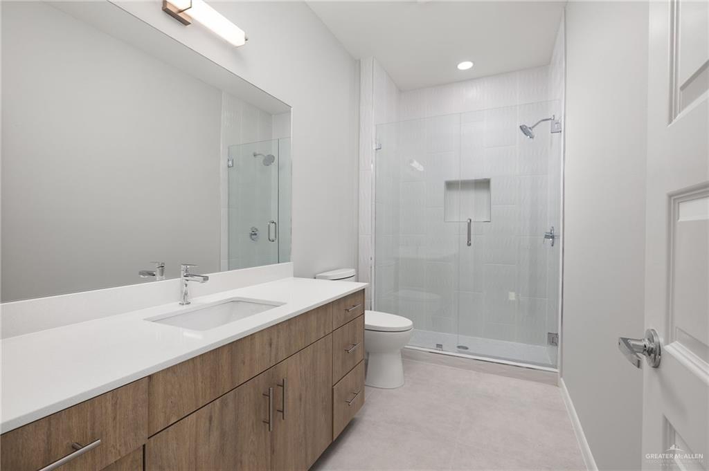 2701 Robin Road Weslaco, TX 78596 - Photo 15 of 30 a bathroom with a sink a toilet and shower