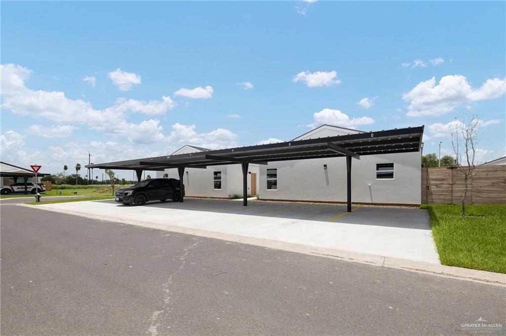 2701 Robin Road Weslaco, TX 78596 - Photo 27 of 30 a front view of a house with a yard and garage