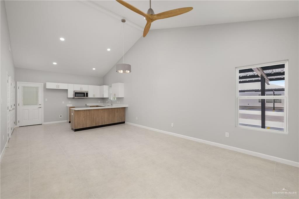 2701 Robin Road Weslaco, TX 78596 - Photo 5 of 30 a view of a kitchen with sink and white cabinets