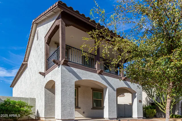 a view of a house with a tree