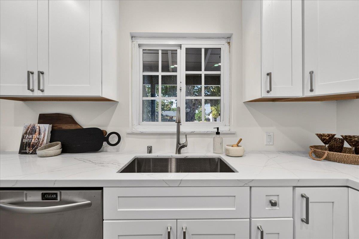 2130 Roenoke Way San Jose, CA 95128 - Photo 2 of 33 a kitchen with a sink and cabinets
