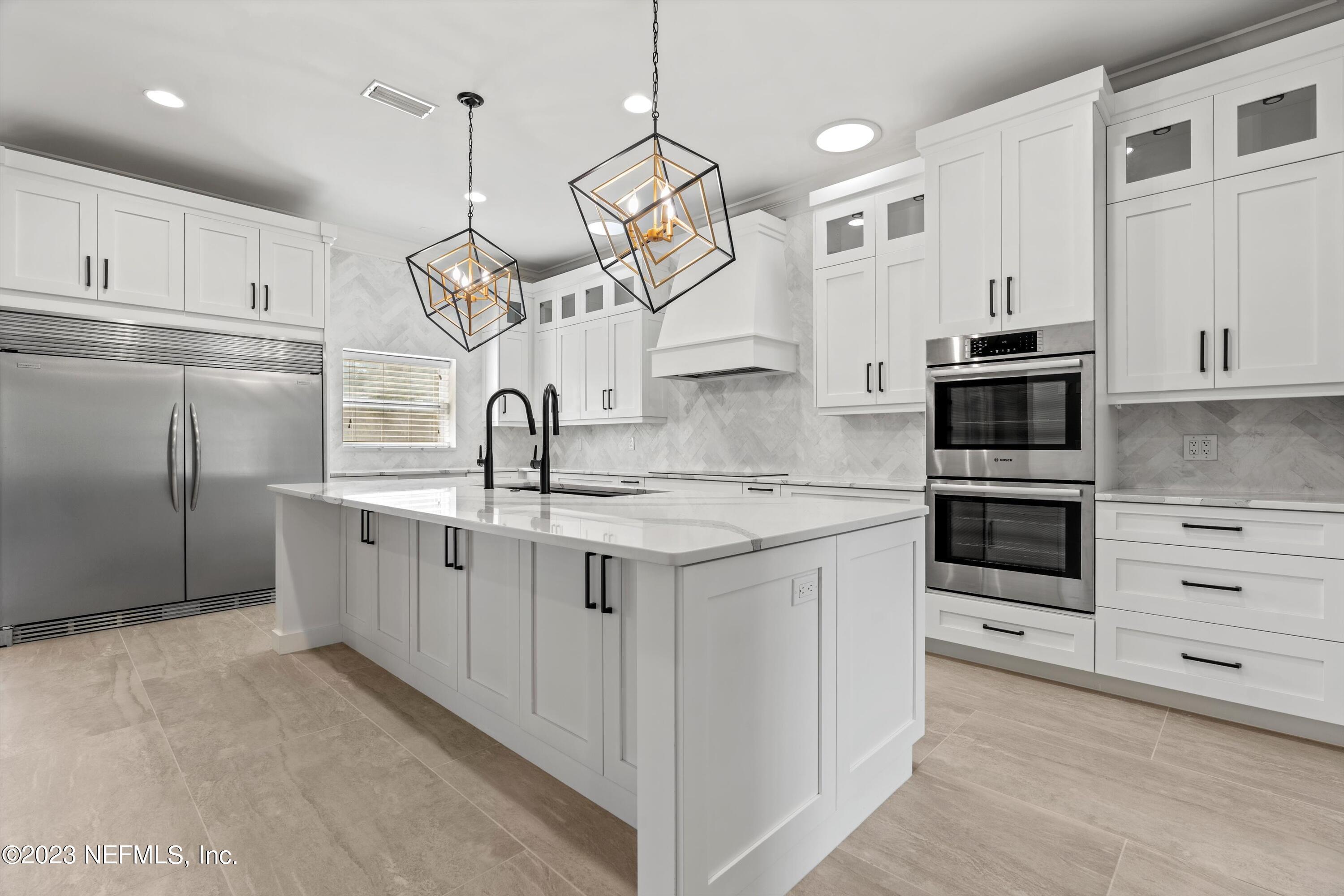 7936 Pine Lake Road Jacksonville, FL 32256 - Photo 17 of 52 a kitchen with stainless steel appliances granite countertop a sink and a stove