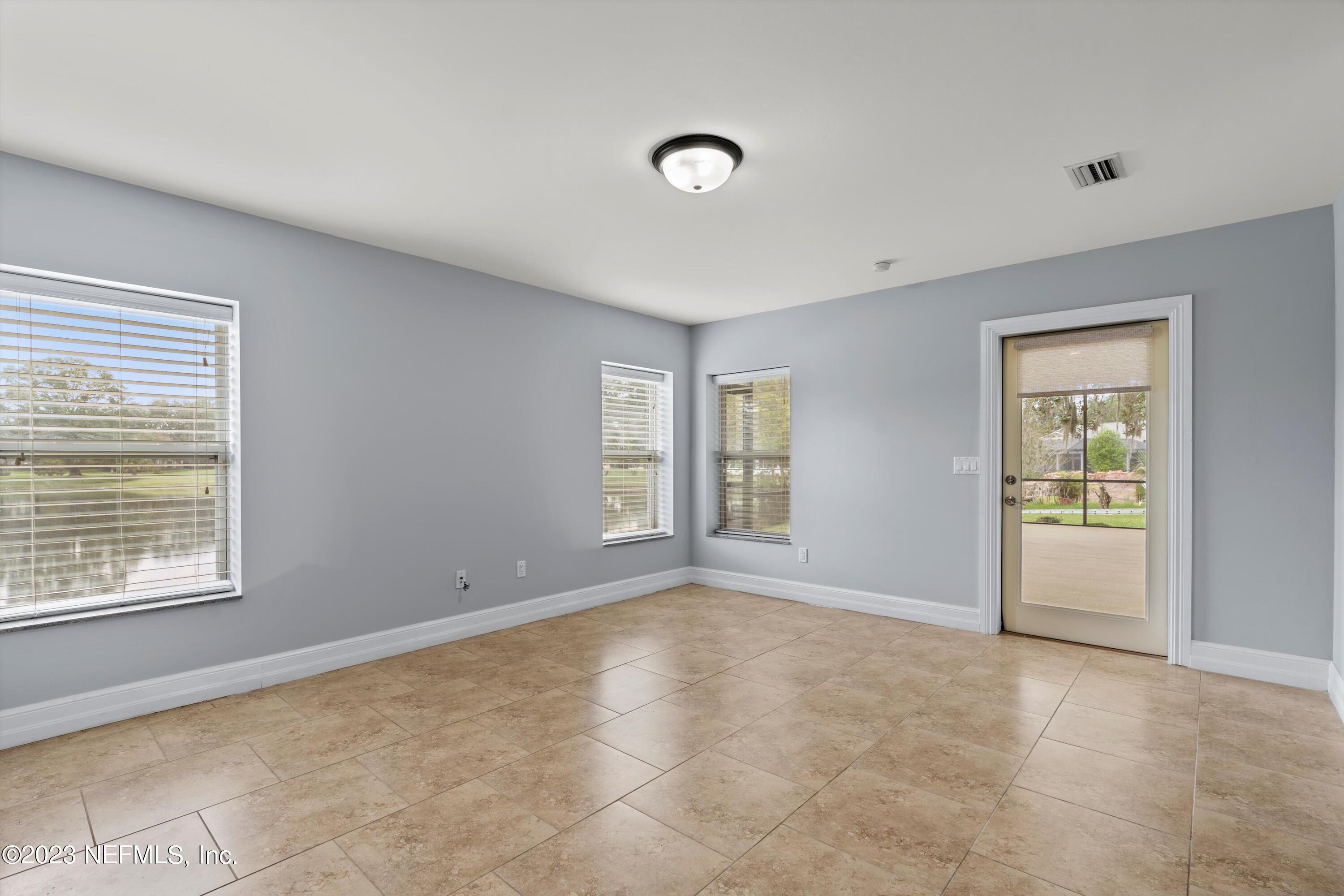 7936 Pine Lake Road Jacksonville, FL 32256 - Photo 26 of 52 a view of an empty room with a window