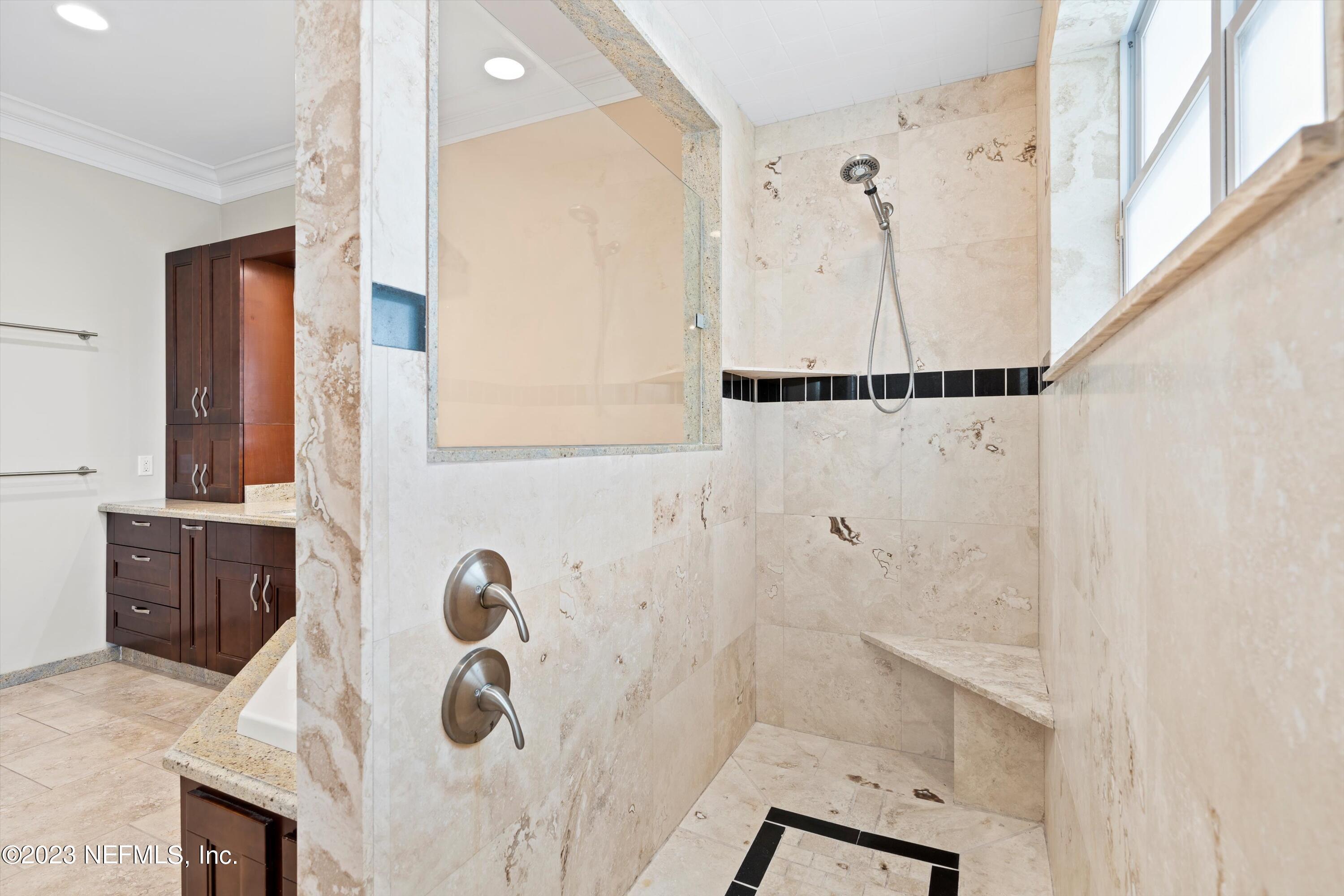 7936 Pine Lake Road Jacksonville, FL 32256 - Photo 47 of 52 a bathroom with a tub and a shower