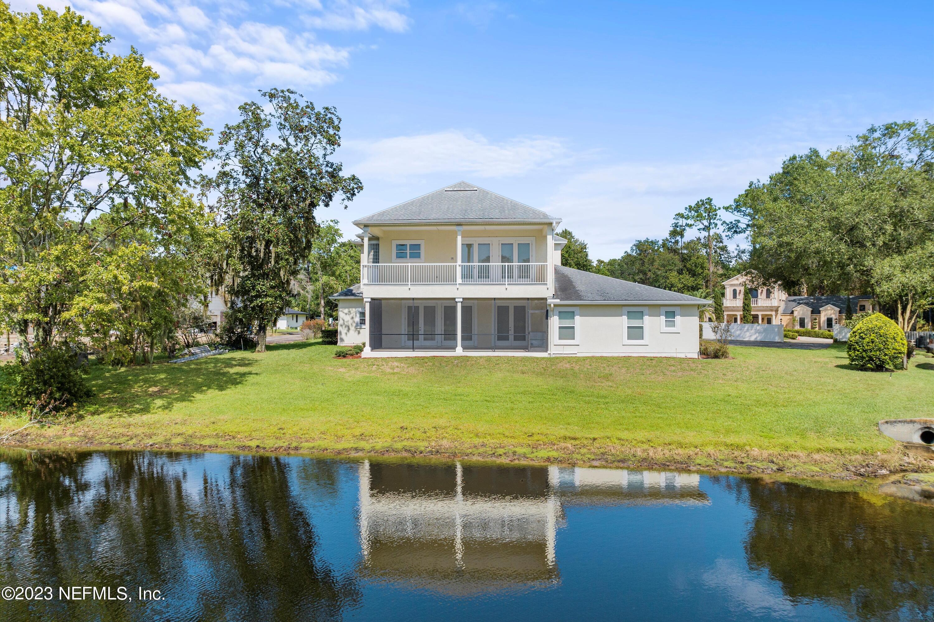 7936 Pine Lake Road Jacksonville, FL 32256 - Photo 50 of 52 a view of a house with a yard