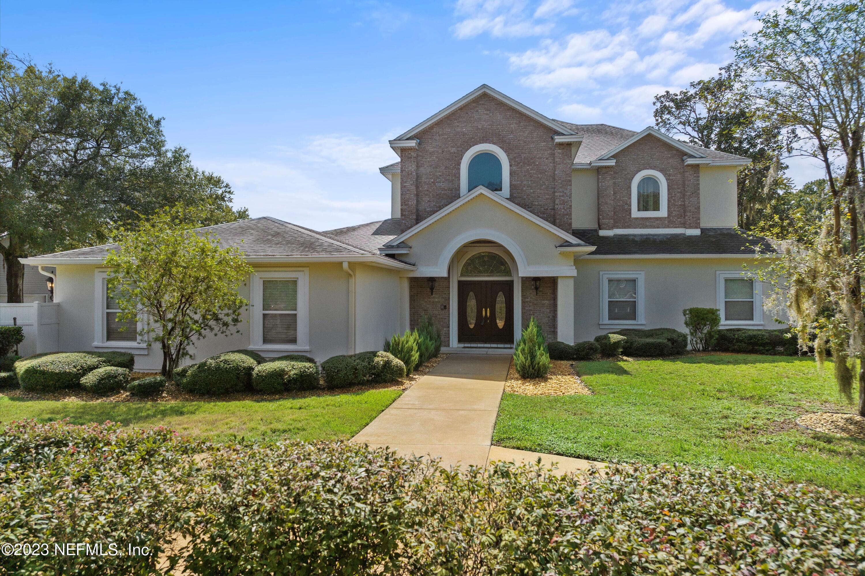 7936 Pine Lake Road Jacksonville, FL 32256 - Photo 5 of 52 a front view of a house with a yard