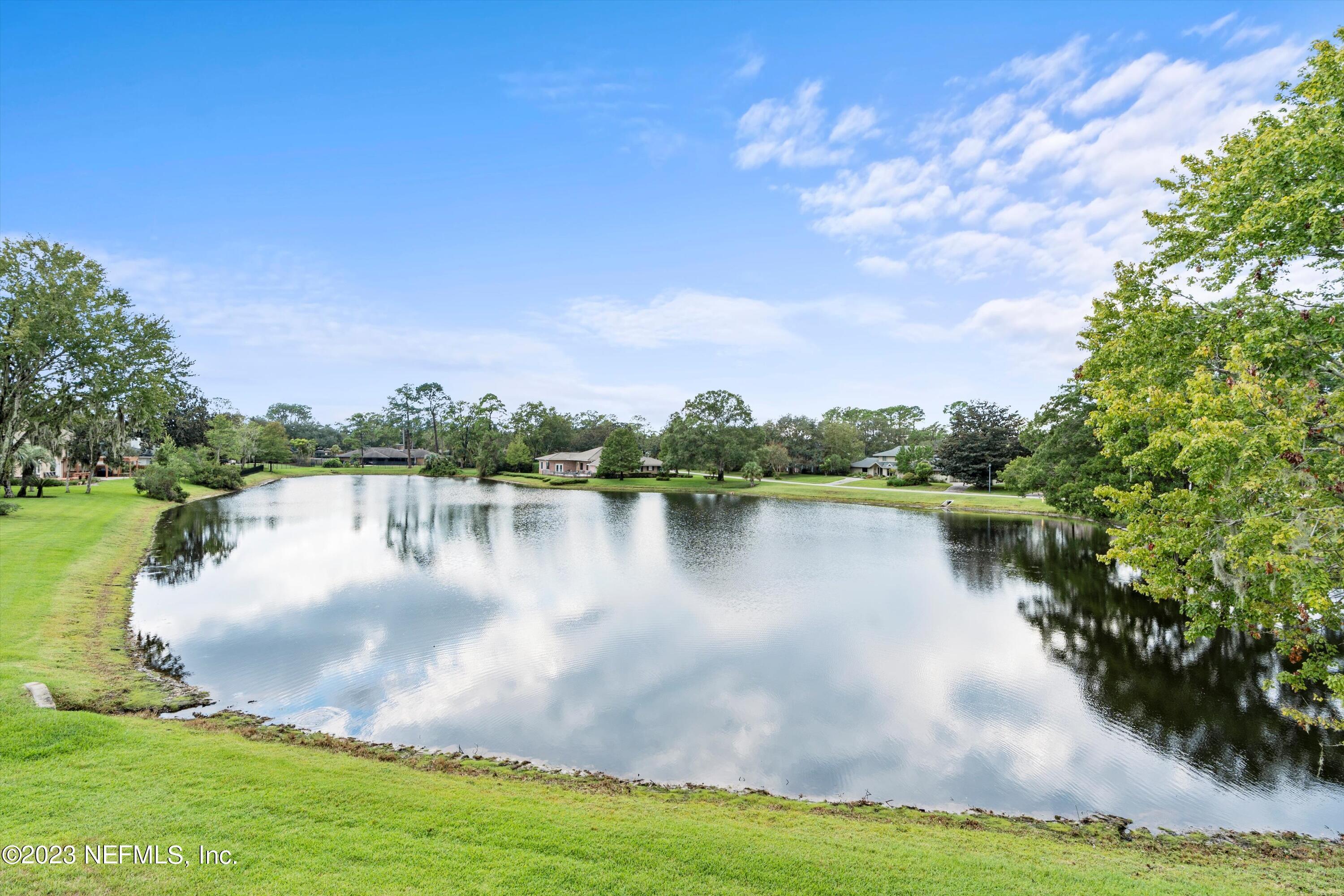 7936 Pine Lake Road Jacksonville, FL 32256 - Photo 52 of 52 a view of a lake with houses in the background