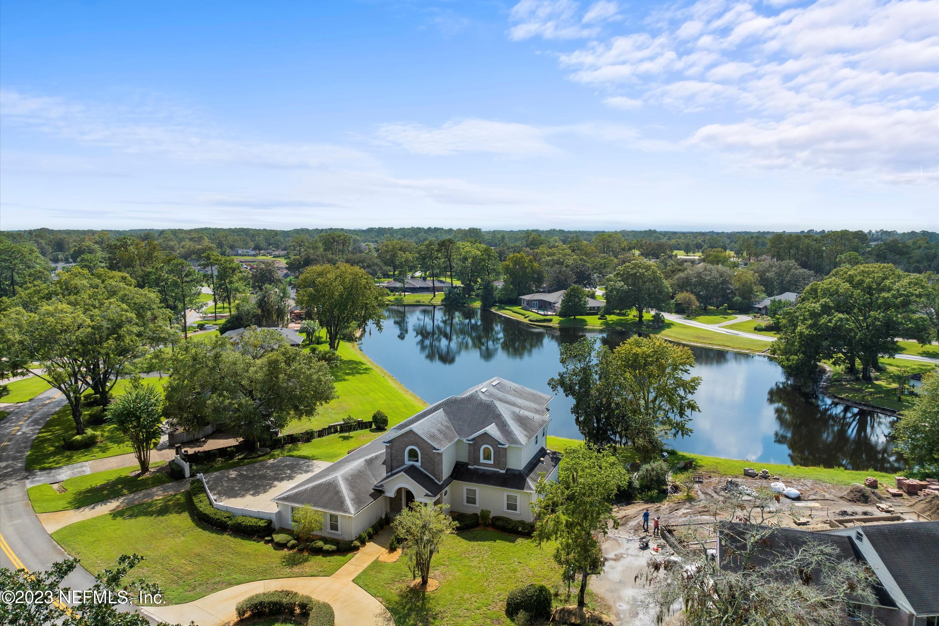 7936 Pine Lake Road Jacksonville, FL 32256 - Photo 8 of 52 an aerial view of a house with a garden