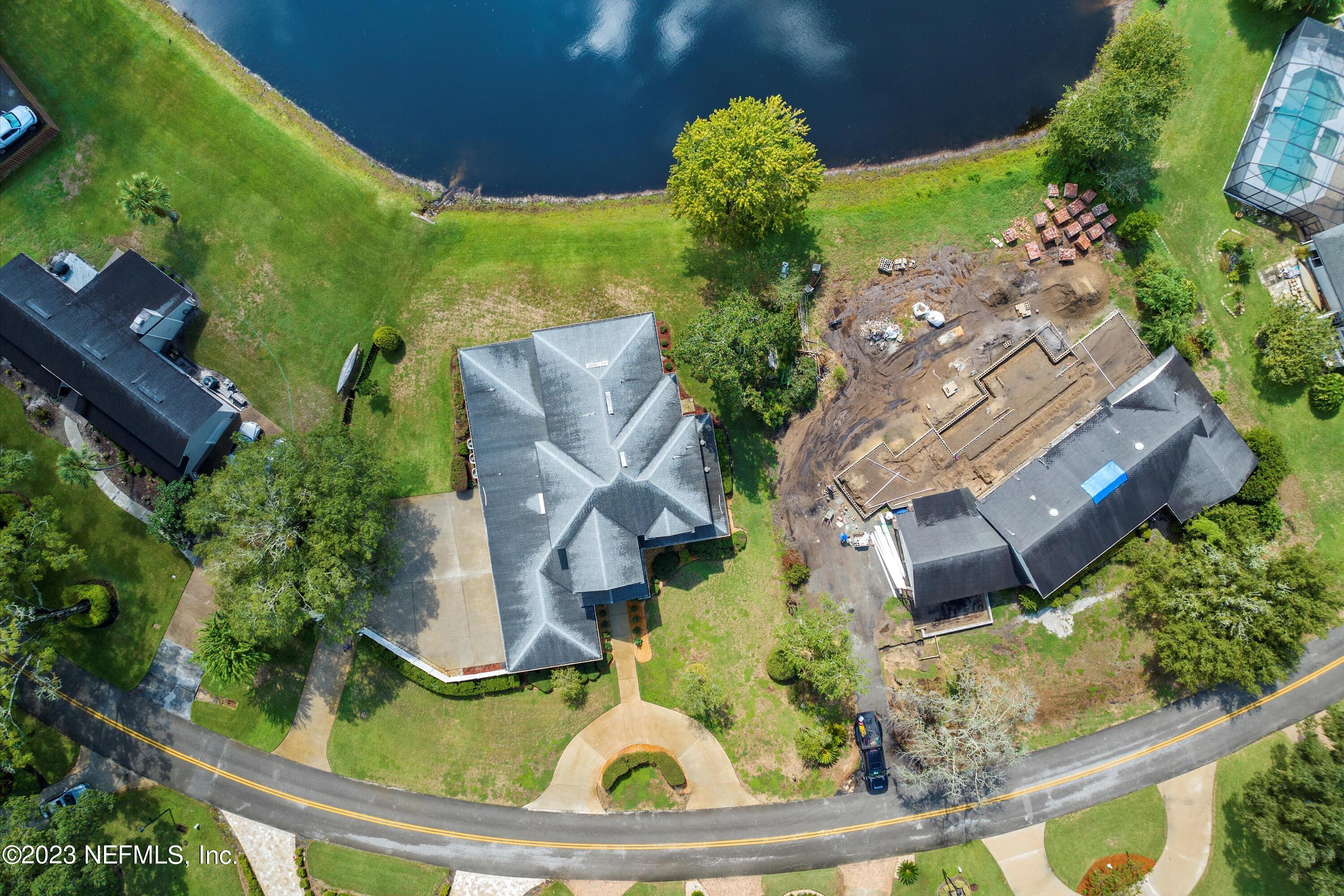 7936 Pine Lake Road Jacksonville, FL 32256 - Photo 9 of 52 an aerial view of a house with garden space and street view