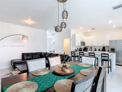 a kitchen with stainless steel appliances a refrigerator stove microwave and cabinets