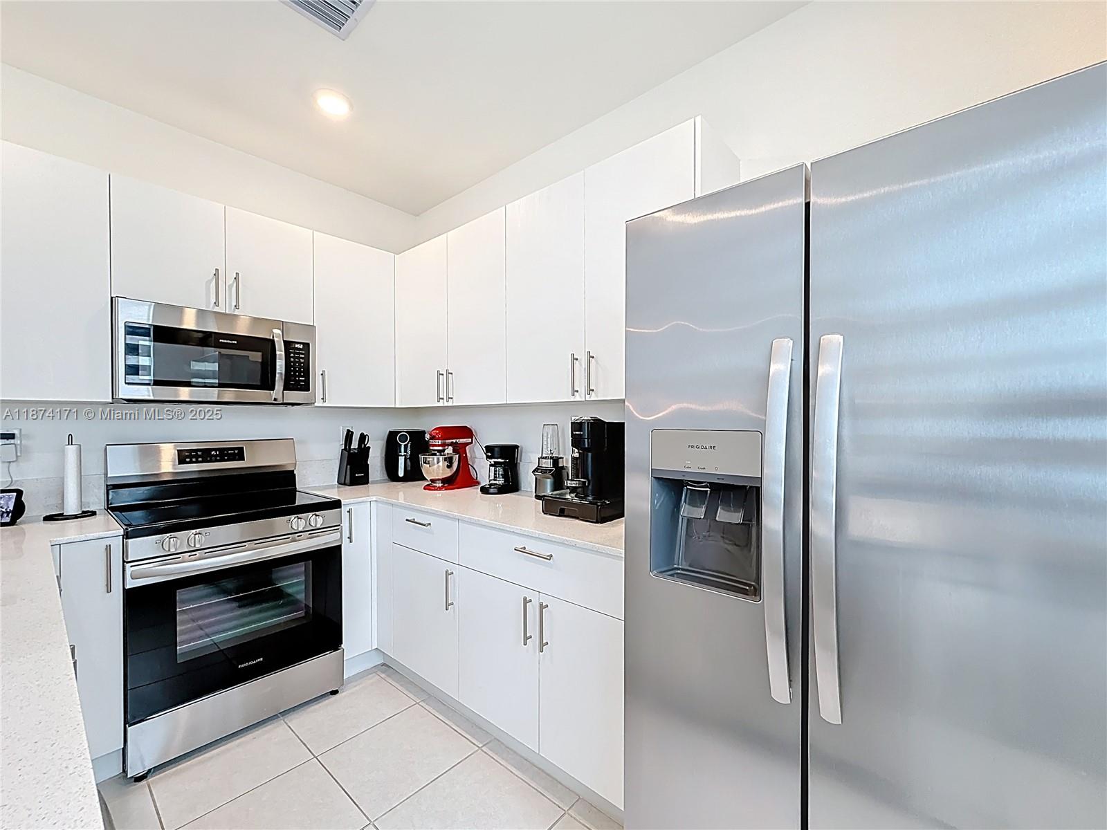 716 Southeast 14th Street Homestead, FL 33034 - Photo 23 of 60 a kitchen with cabinets stainless steel appliances and counter space