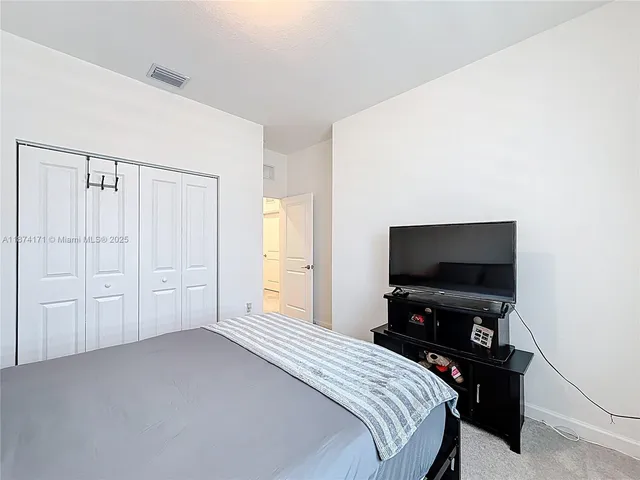 a bathroom with a toilet sink and shower