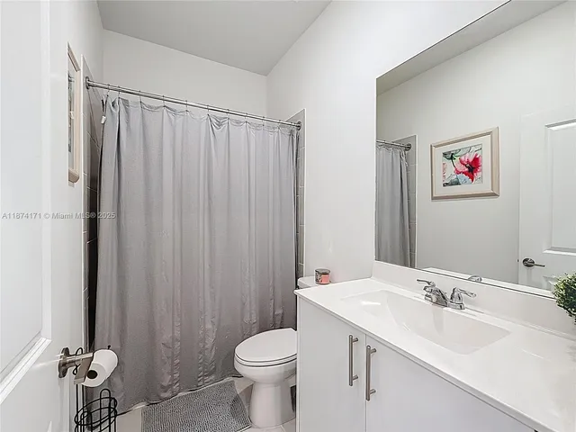 a living room with lots of furniture and a chandelier
