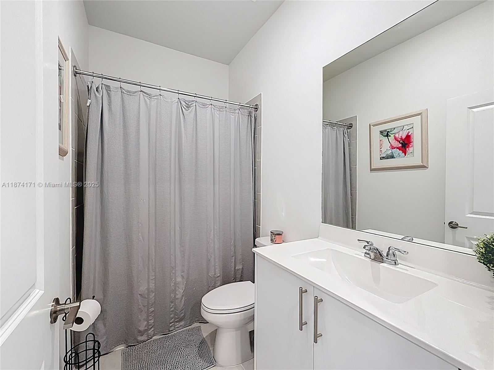 716 Southeast 14th Street Homestead, FL 33034 - Photo 36 of 60 a bathroom with a toilet sink and shower