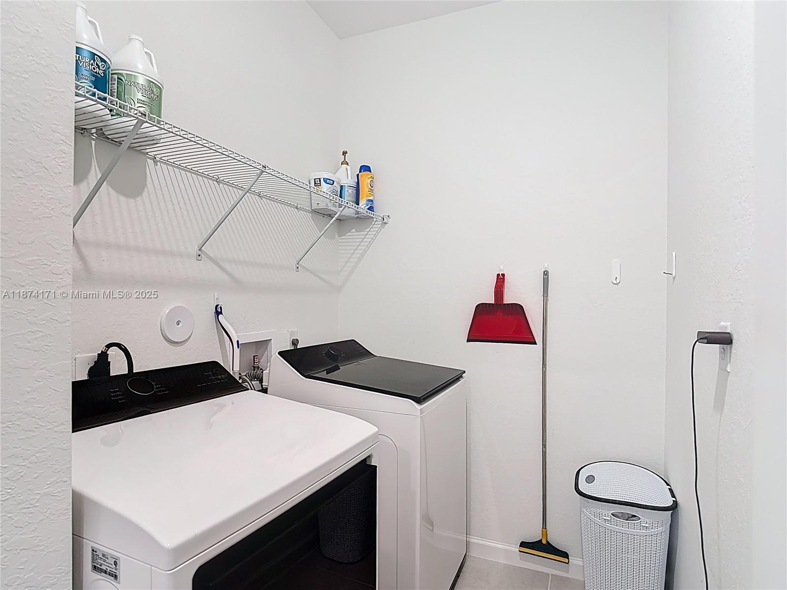 716 Southeast 14th Street Homestead, FL 33034 - Photo 42 of 60 a kitchen with a refrigerator and a stove