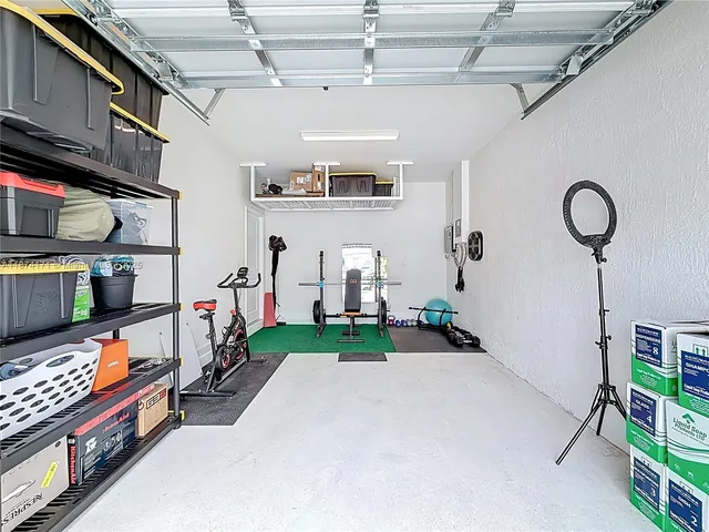 an aerial view of a house with a mountain