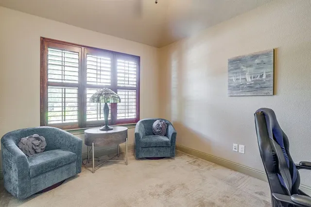 a living room with a couch and a window