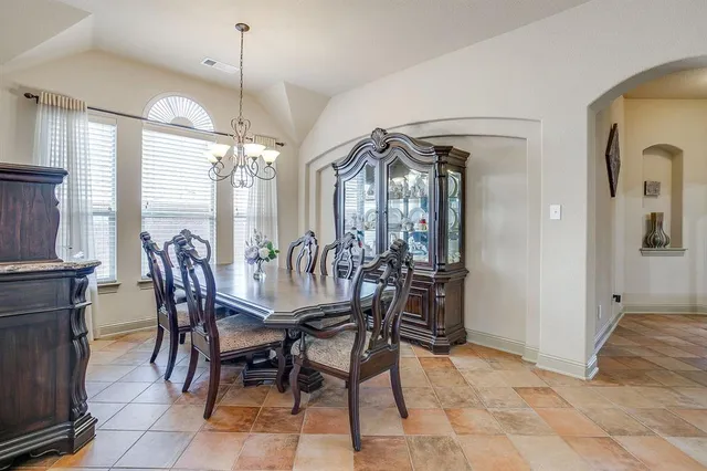 a view of a dining room with furniture and window