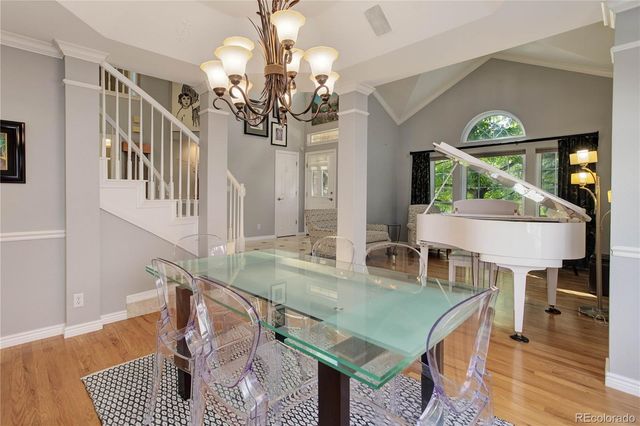 a view of a dining room with furniture and wooden floor