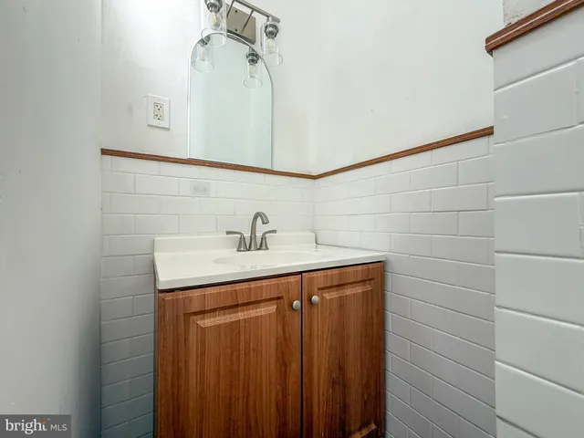 a bathroom with a sink and vanity