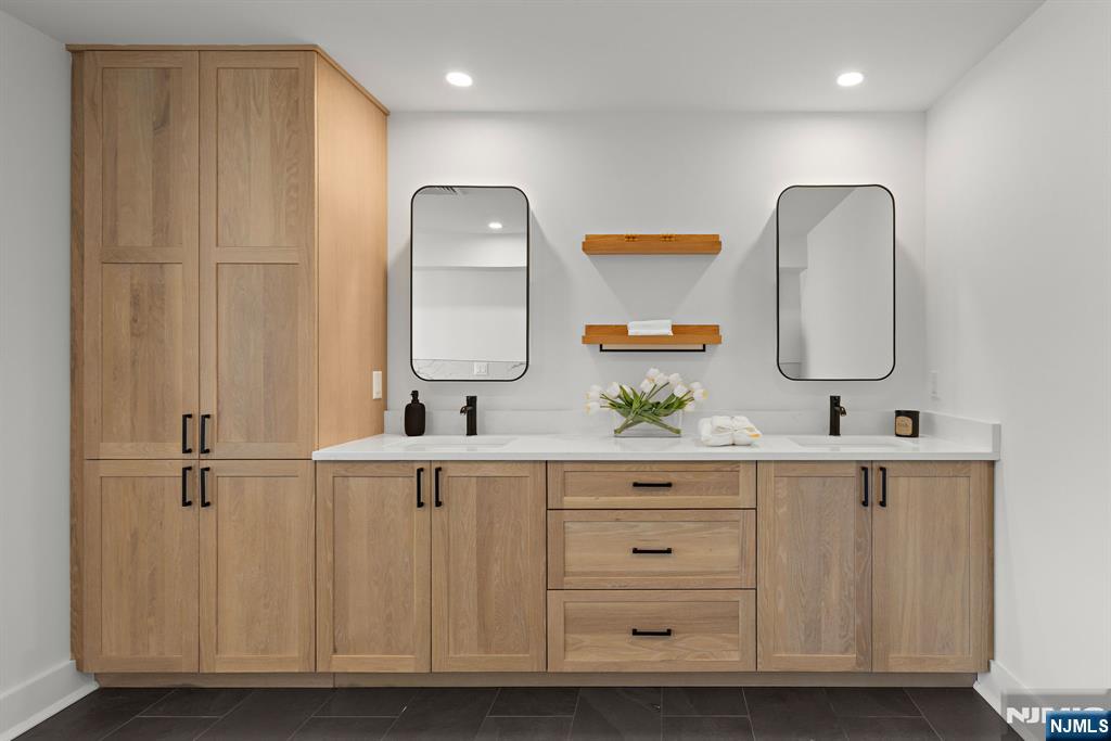 27 Shore Road Edgewater, NJ 07020 - Photo 32 of 48 a bathroom with a sink vanity and mirror
