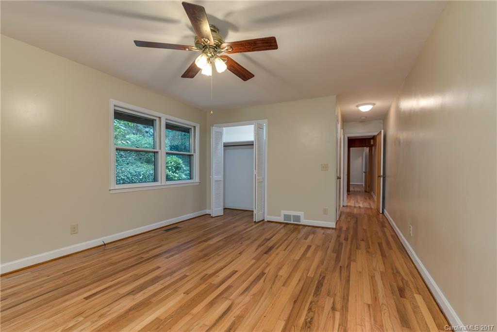 81 Jericho Drive Tryon, NC 28782 - Photo 12 of 23 wooden floor in an empty room with a window
