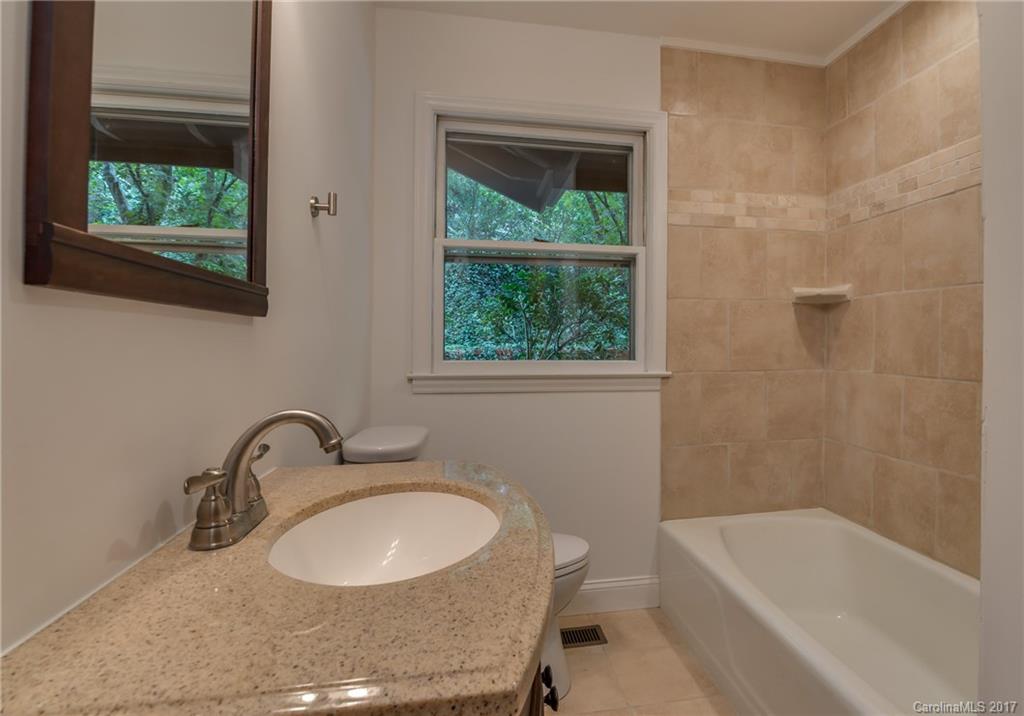 81 Jericho Drive Tryon, NC 28782 - Photo 15 of 23 a bathroom with a sink and a bathtub