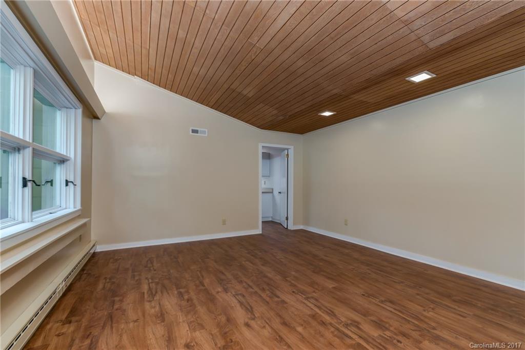 81 Jericho Drive Tryon, NC 28782 - Photo 18 of 23 a view of empty room with wooden floor