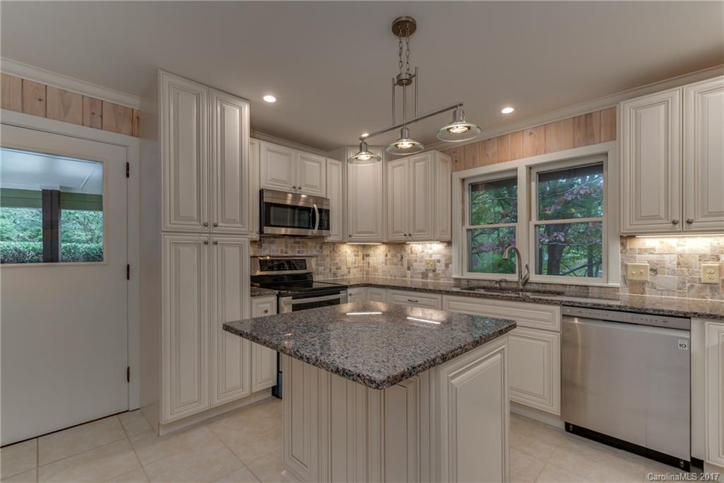 81 Jericho Drive Tryon, NC 28782 - Photo 6 of 23 a kitchen with a center island appliances and cabinets