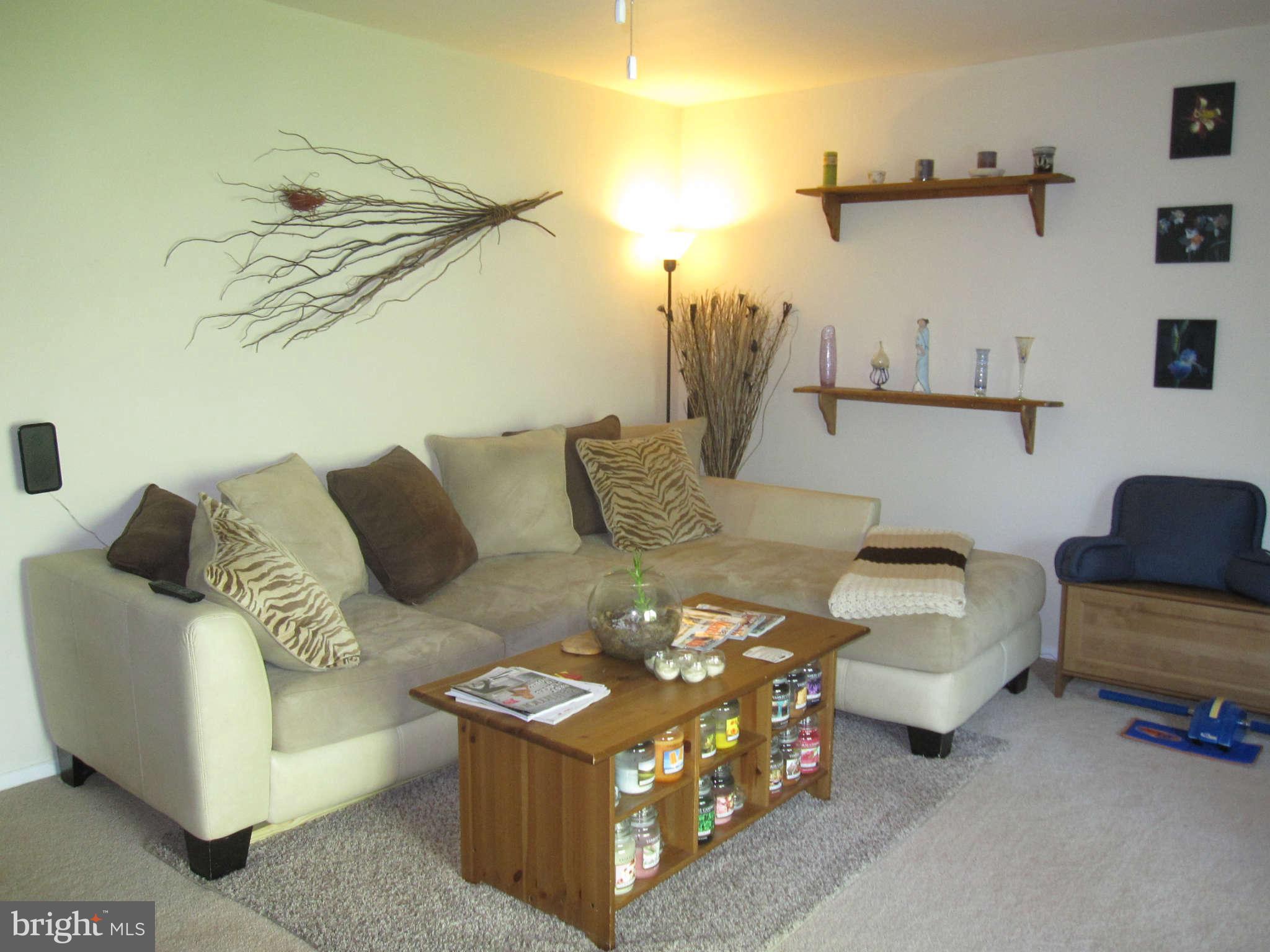 89 Valley Ridge Loop Cockeysville, MD 21030 - Photo 11 of 16 a living room with furniture and a ceiling fan