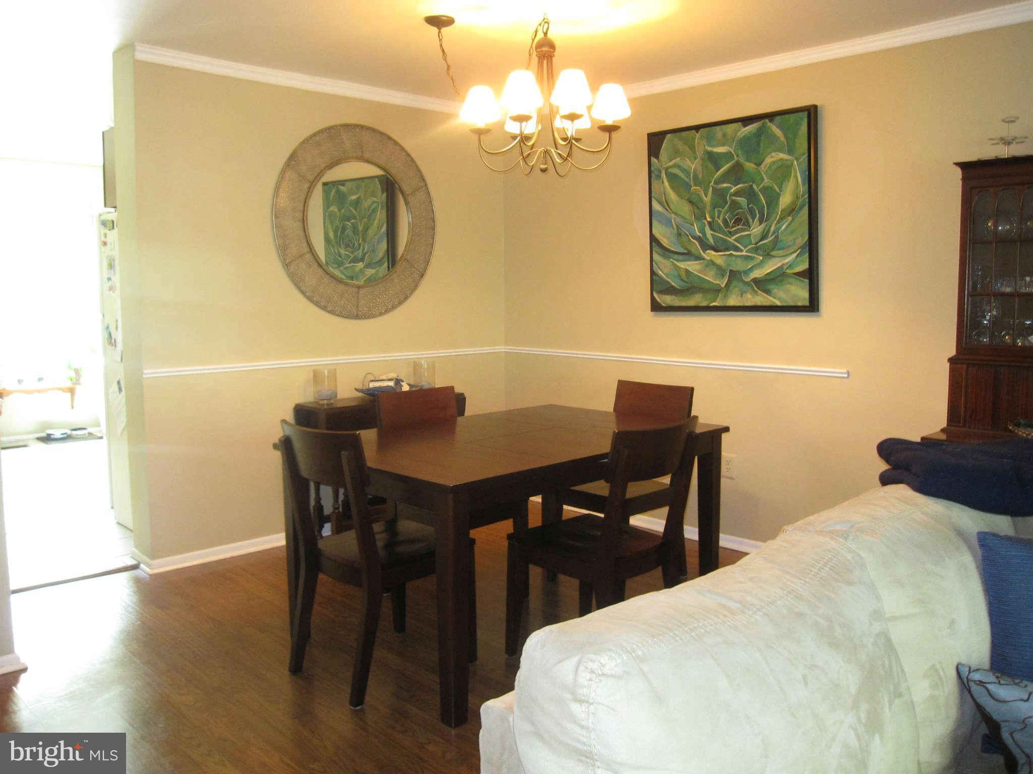 89 Valley Ridge Loop Cockeysville, MD 21030 - Photo 3 of 16 a bedroom with a table and chairs