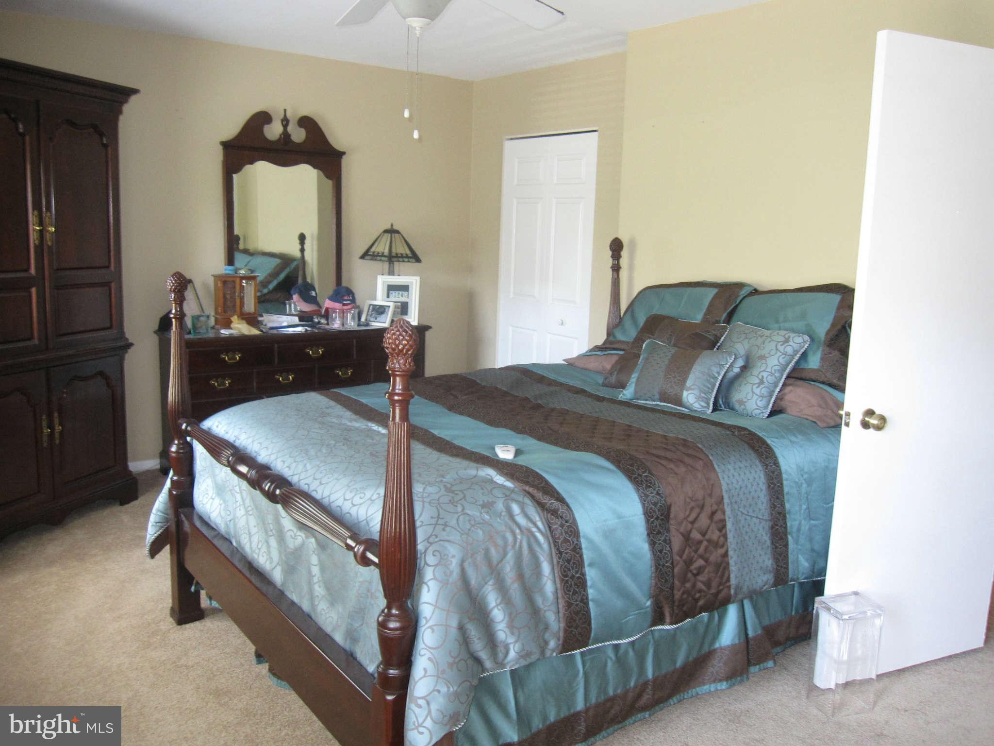 89 Valley Ridge Loop Cockeysville, MD 21030 - Photo 4 of 16 a bedroom with a bed and wooden floor