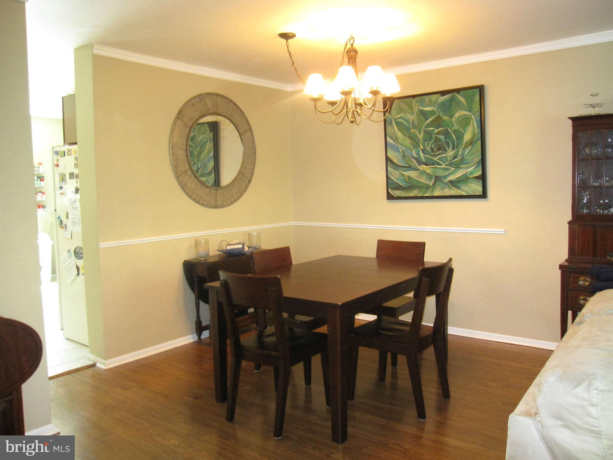 89 Valley Ridge Loop Cockeysville, MD 21030 - Photo 10 of 16 a view of a dining room with furniture and chandelier