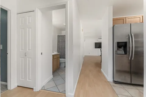a view of a refrigerator in kitchen