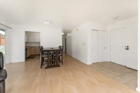 a workspace with furniture and kitchen view