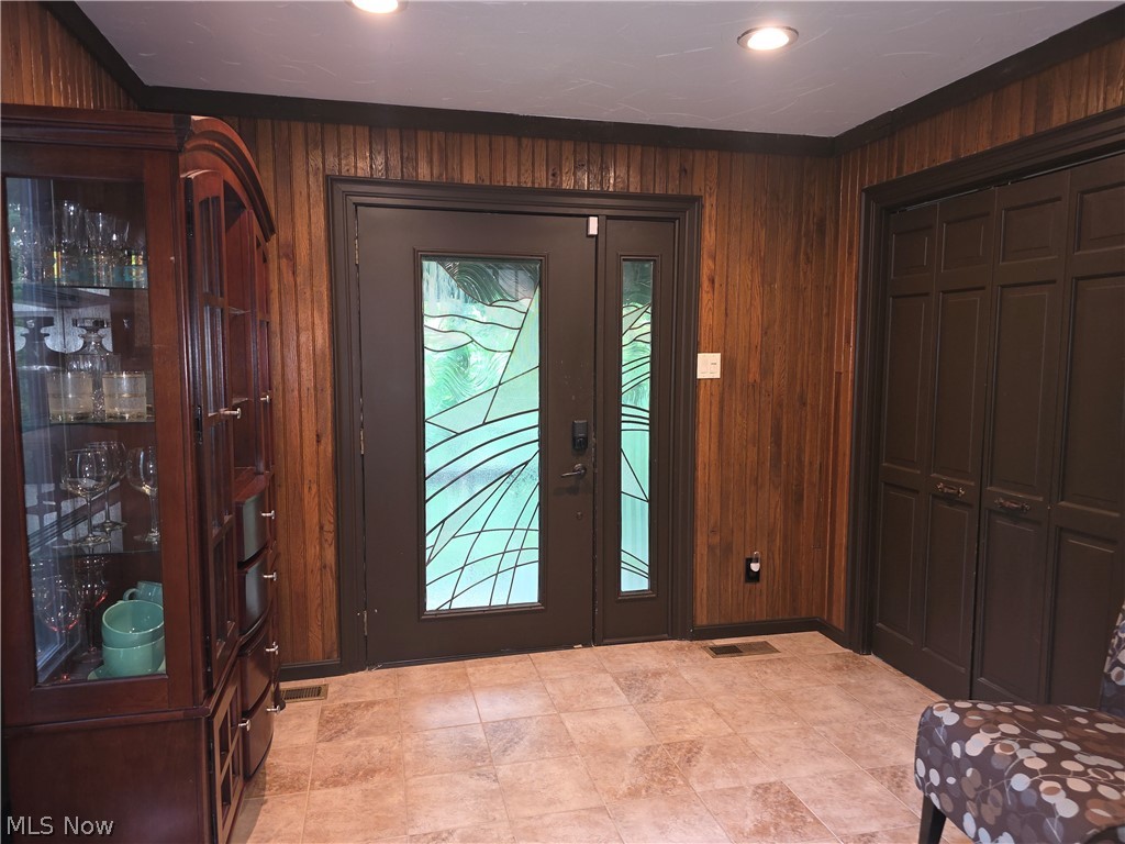 2868 Shade Road Akron, OH 44333 - Photo 25 of 49 Entryway featuring double doors with decorative frosted glass inserts