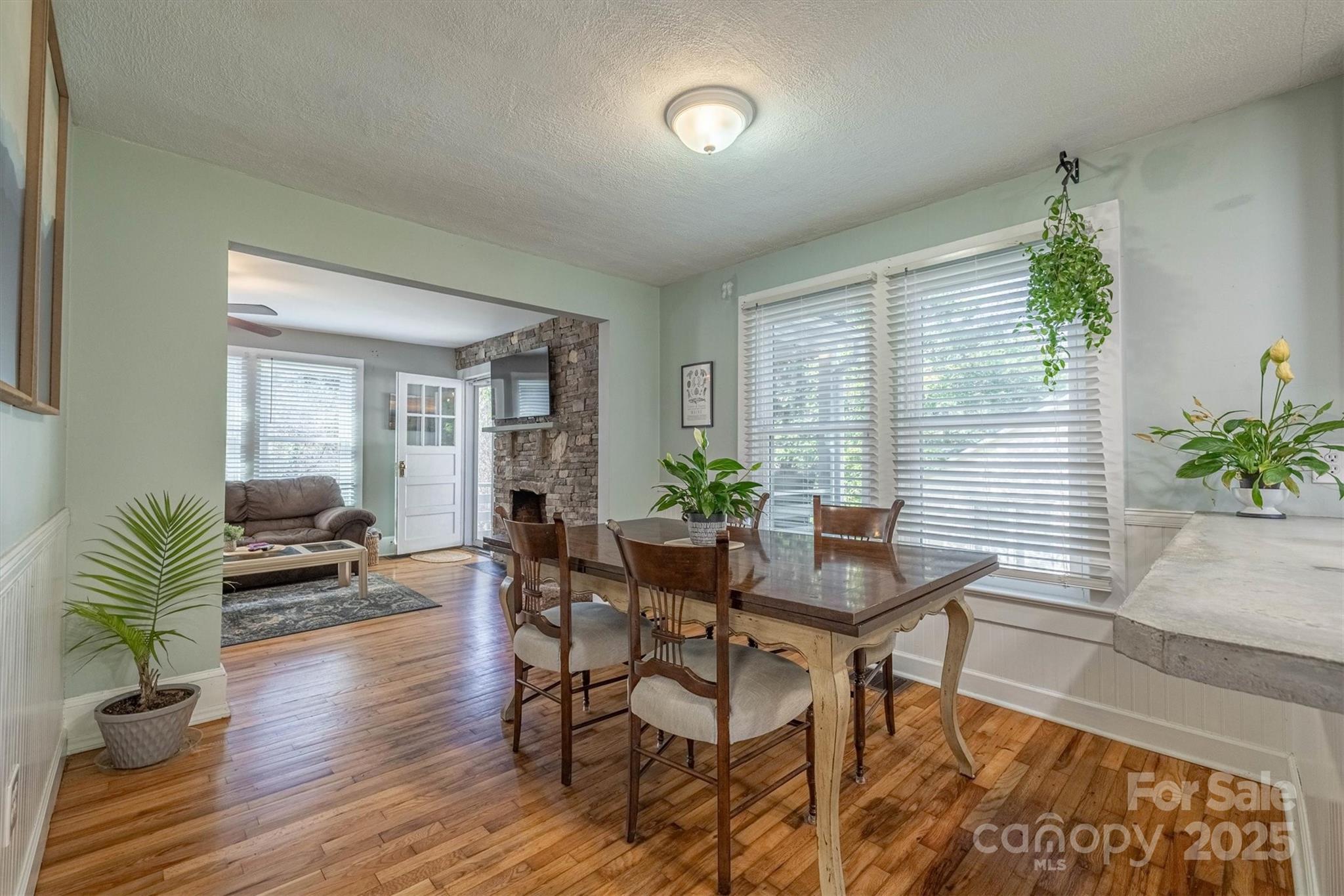 244 North Anderson Street Morganton, NC 28655 - Photo 9 of 29 a dining room with furniture and wooden floor