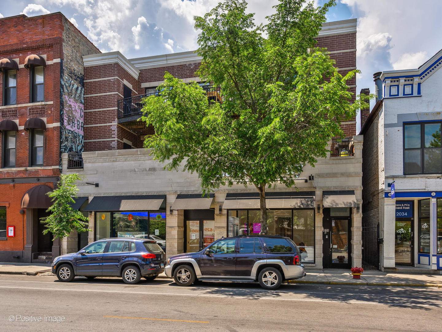 2030 North Halsted Street, Unit 2N Chicago, IL 60614 - Photo 1 of 26 a car parked in front of a building