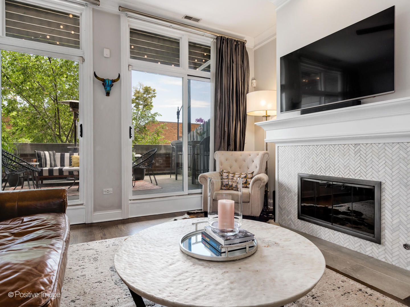 2030 North Halsted Street, Unit 2N Chicago, IL 60614 - Photo 4 of 26 a living room with furniture a flat screen tv and a fireplace