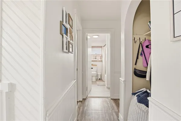 a view of an entryway with wooden floor