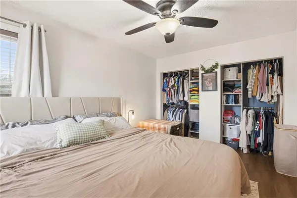 a bedroom with a bed and a large closet