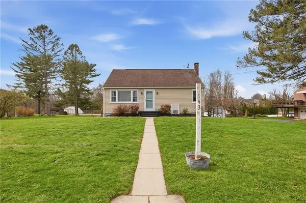 a front view of a house with garden
