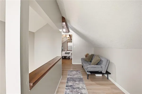 a living room with furniture and a rug