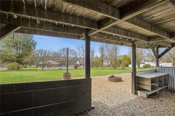 a view of a two room with wooden floor and wooden floor