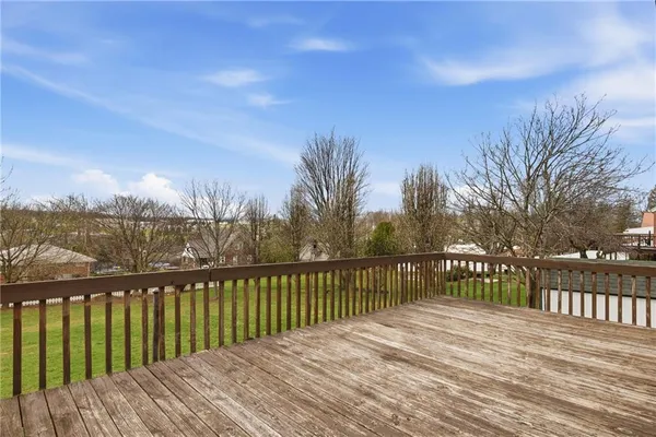 a view of wooden deck and city view