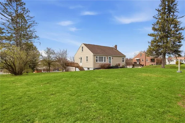 a view of house with garden